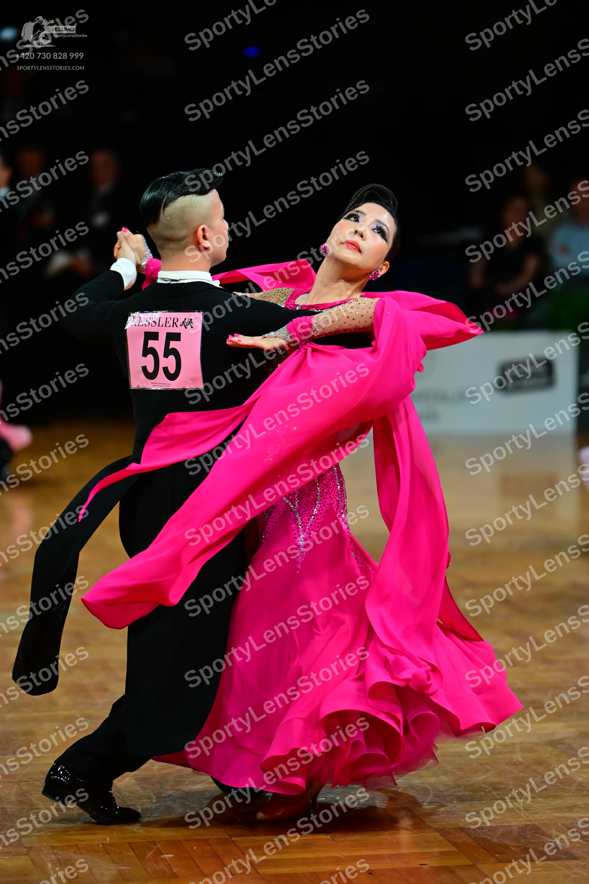 Dancesport competitor #55: Male dancer: black long-sleeved dance top with a white collar and black trousers