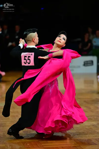 Dancesport competitor #55: Male dancer: black long-sleeved dance top with a white collar and black trousers