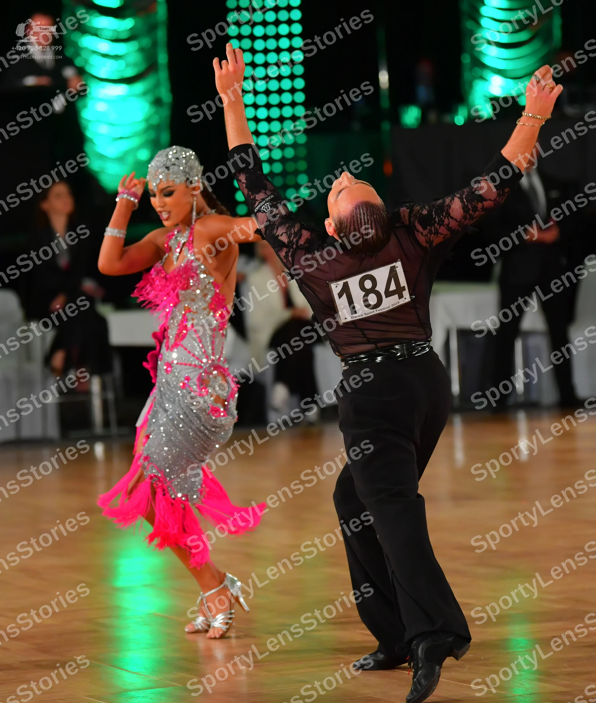 Dancesport competitor #184: Male dancer: black long-sleeved shirt with black lace/sequin patterns and black