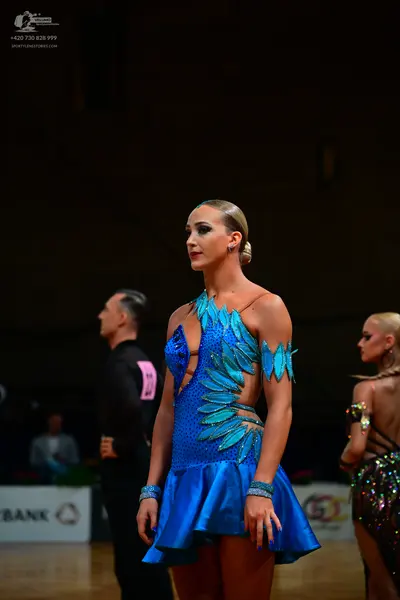 Dancesport competitor: Male dancer: black suit