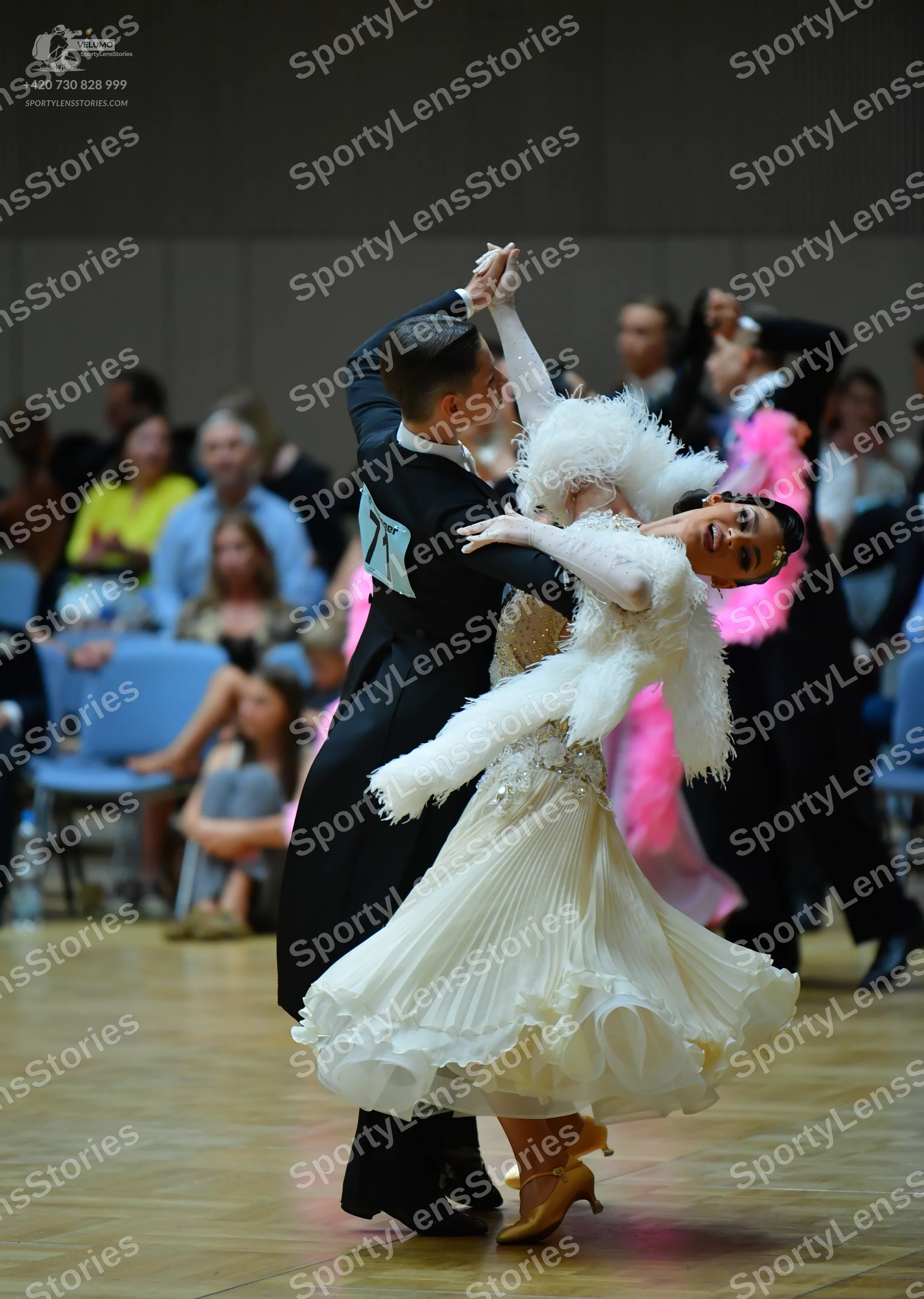 Dancesport competitor: Male dancer: black suit with a white shirt