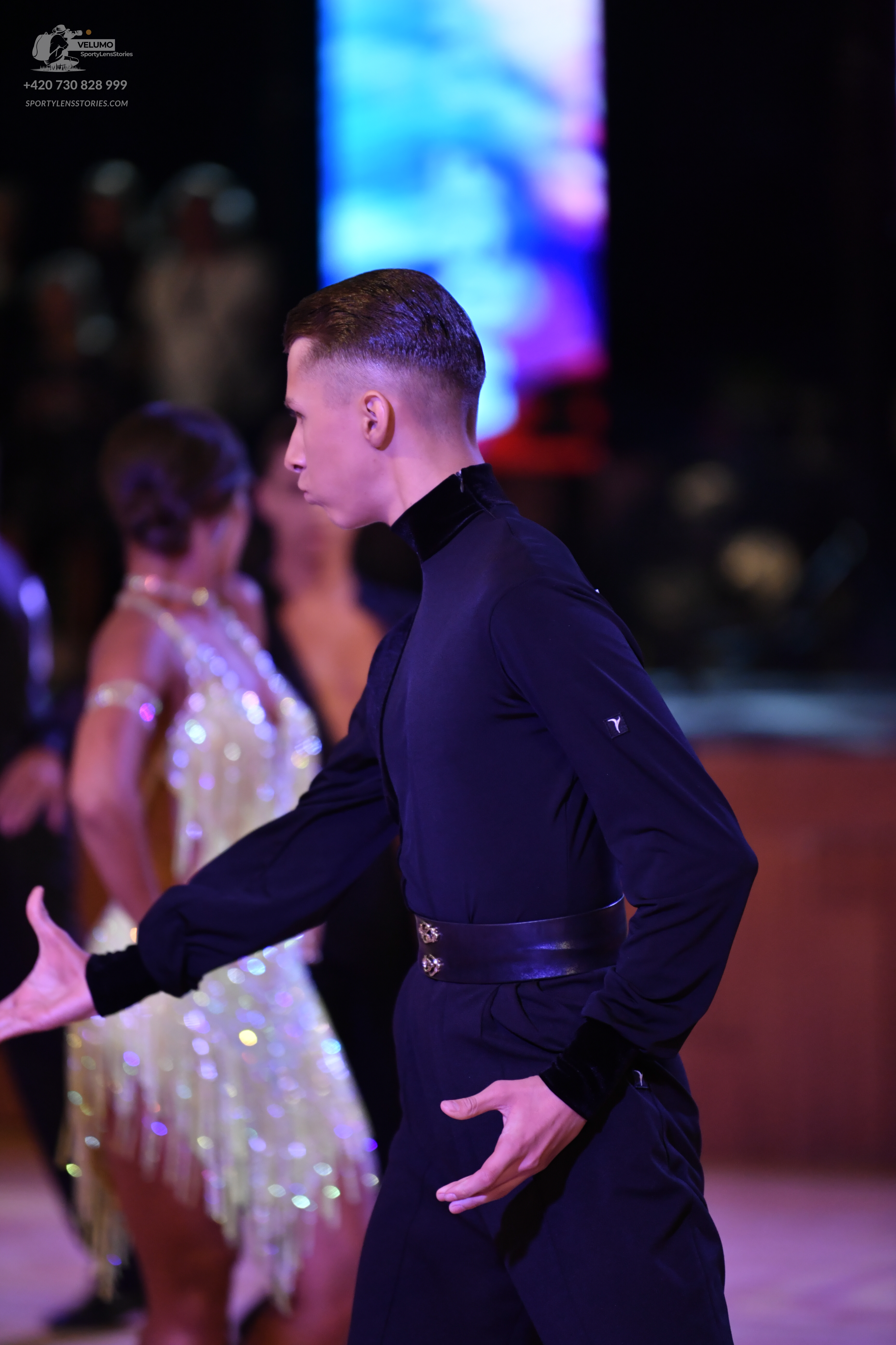 Dancesport competitor: Male:** Black suit with sequin lapels