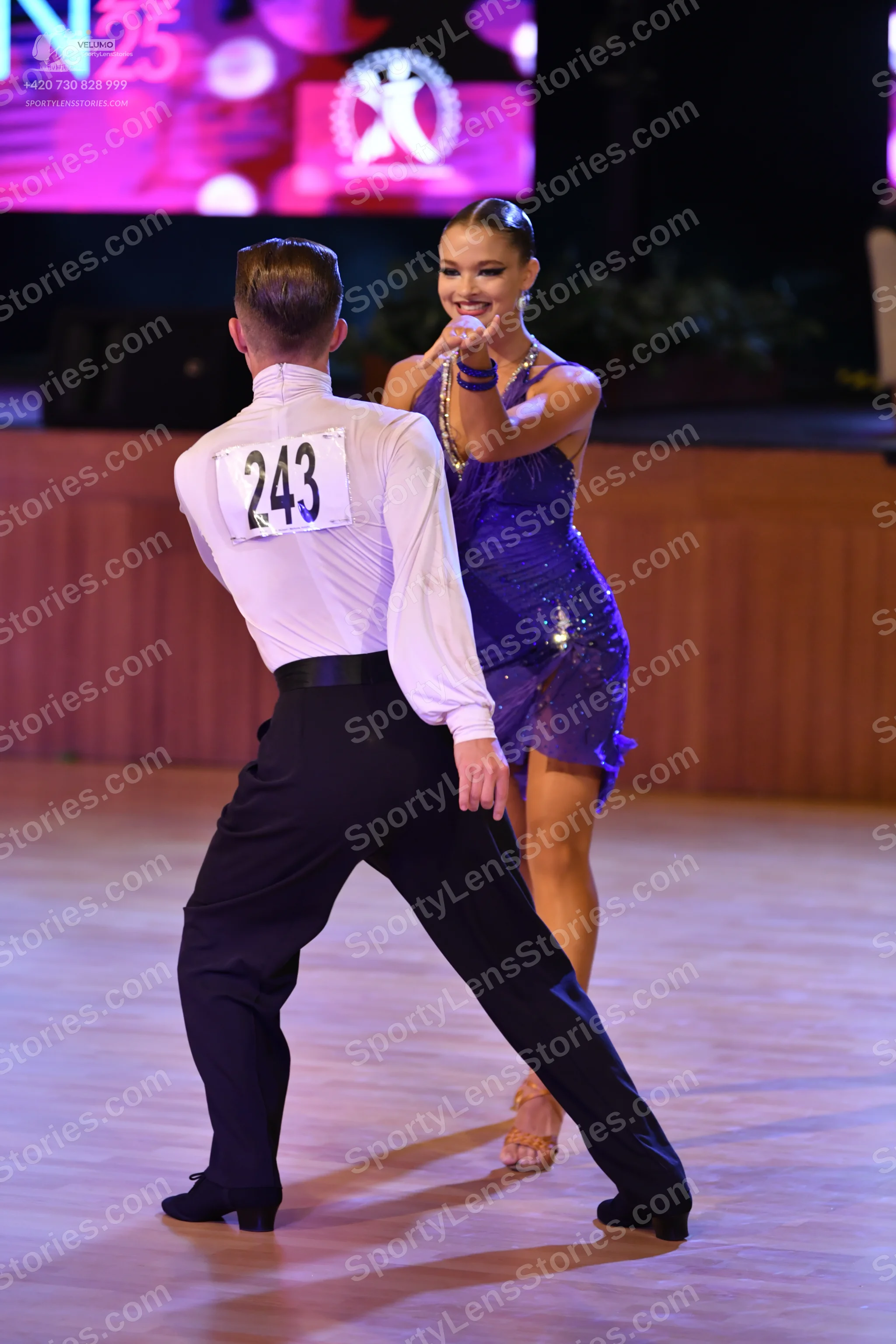 Dancesport competitor #243: Male dancer: white long-sleeved shirt and black trousers