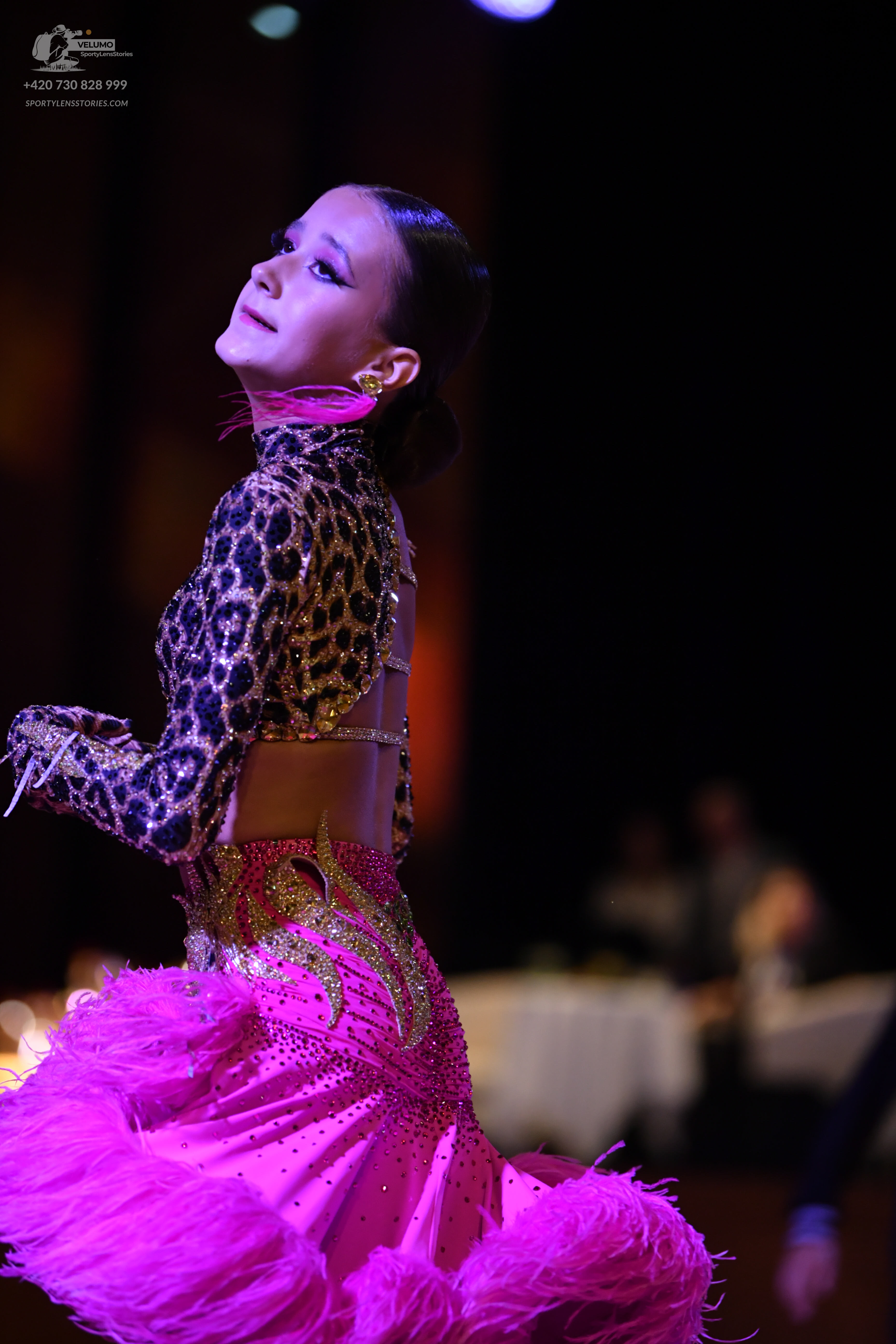 Dancesport competitor: ** Female
*   **Color:** Bright Pink
*   **Fabric:** Primarily satin, heavily em