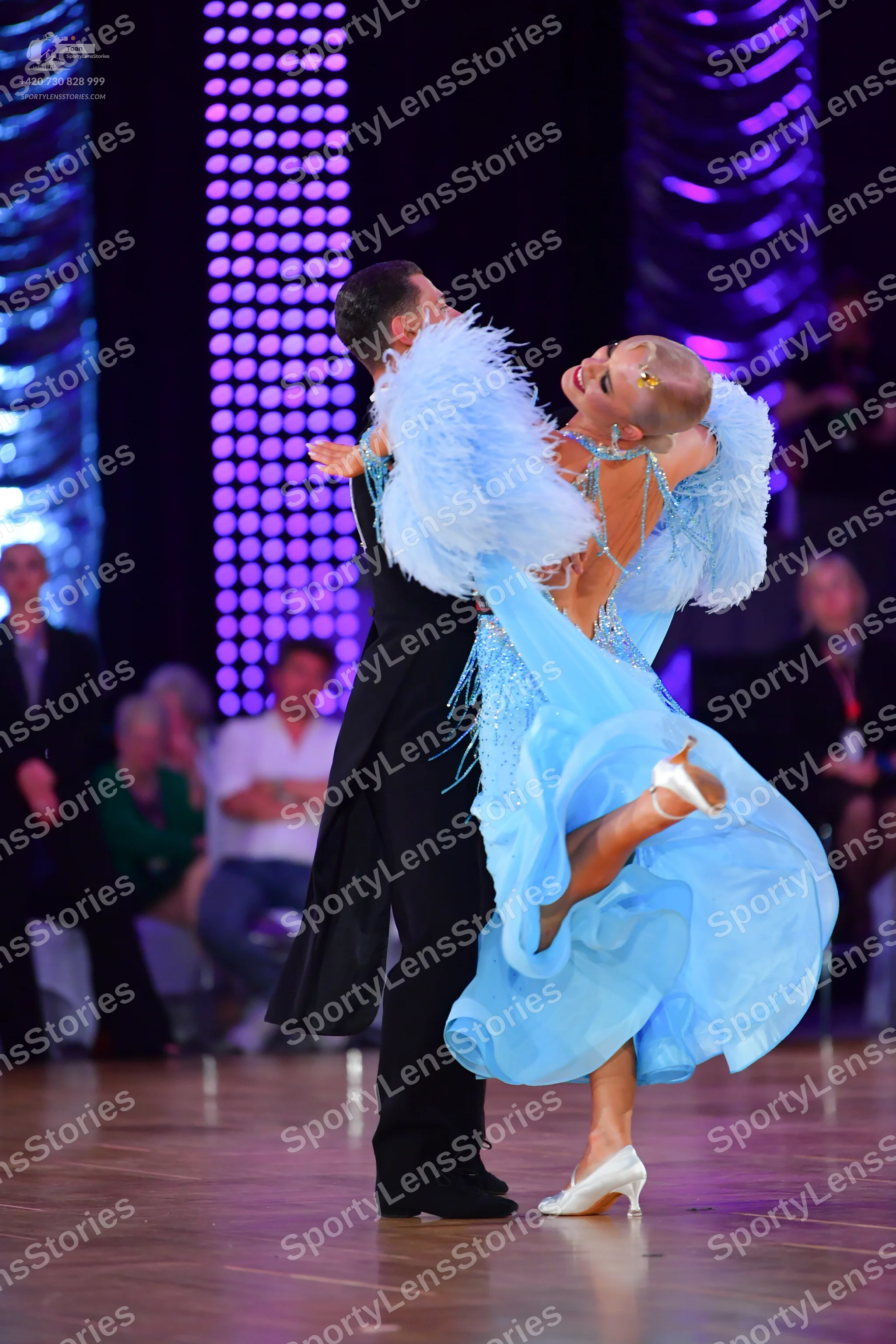Dancesport competitor: Male dancer: black ballroom tailcoat suit with black trousers and black dance sh