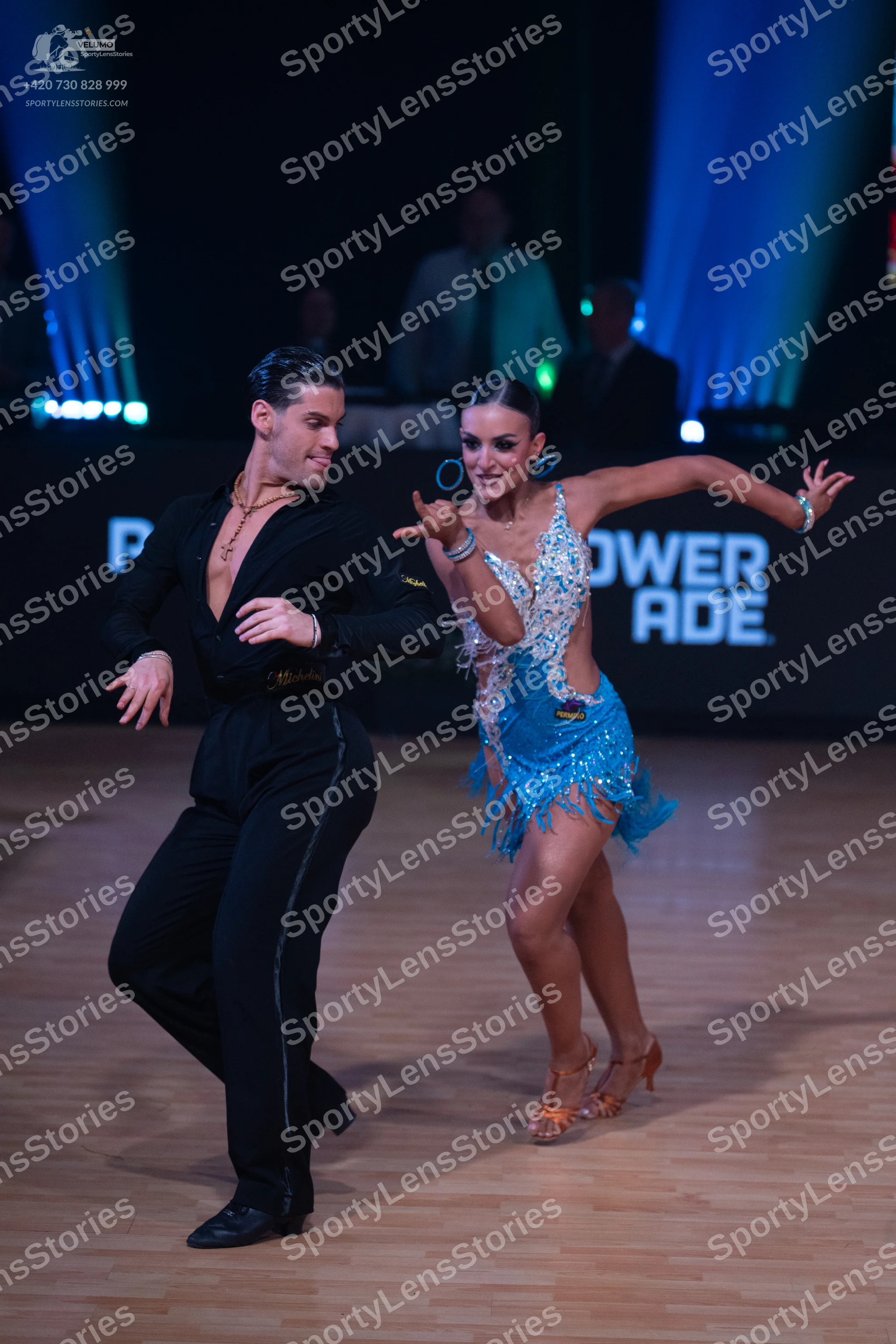 Dancesport competitor: Male dancer: black long-sleeved shirt and black trousers with a thin sparkly str