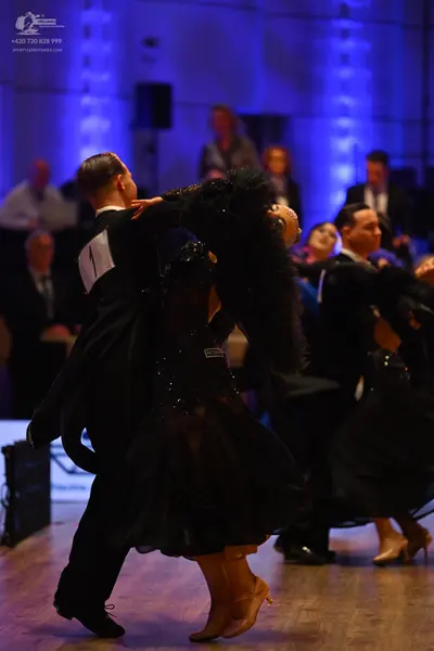 Dancesport competitor: Male dancer: black suit