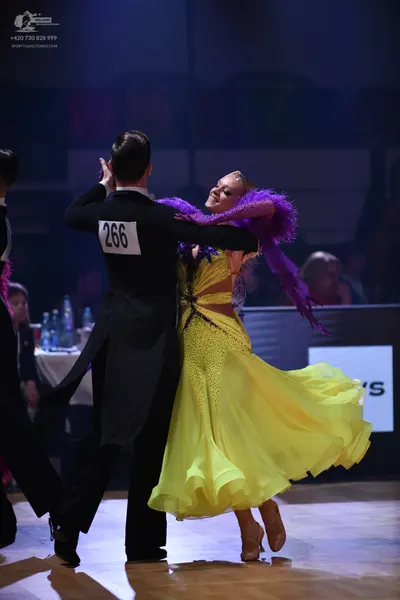 Dancesport competitor: Male dancer: black tailcoat with a white shirt and black trousers