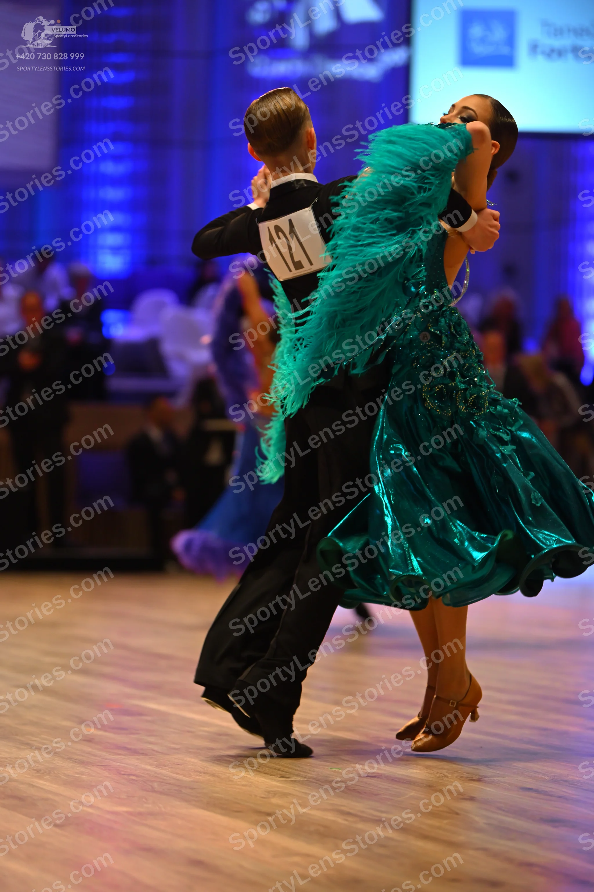Dancesport competitor: Male dancer: black suit with a white shirt