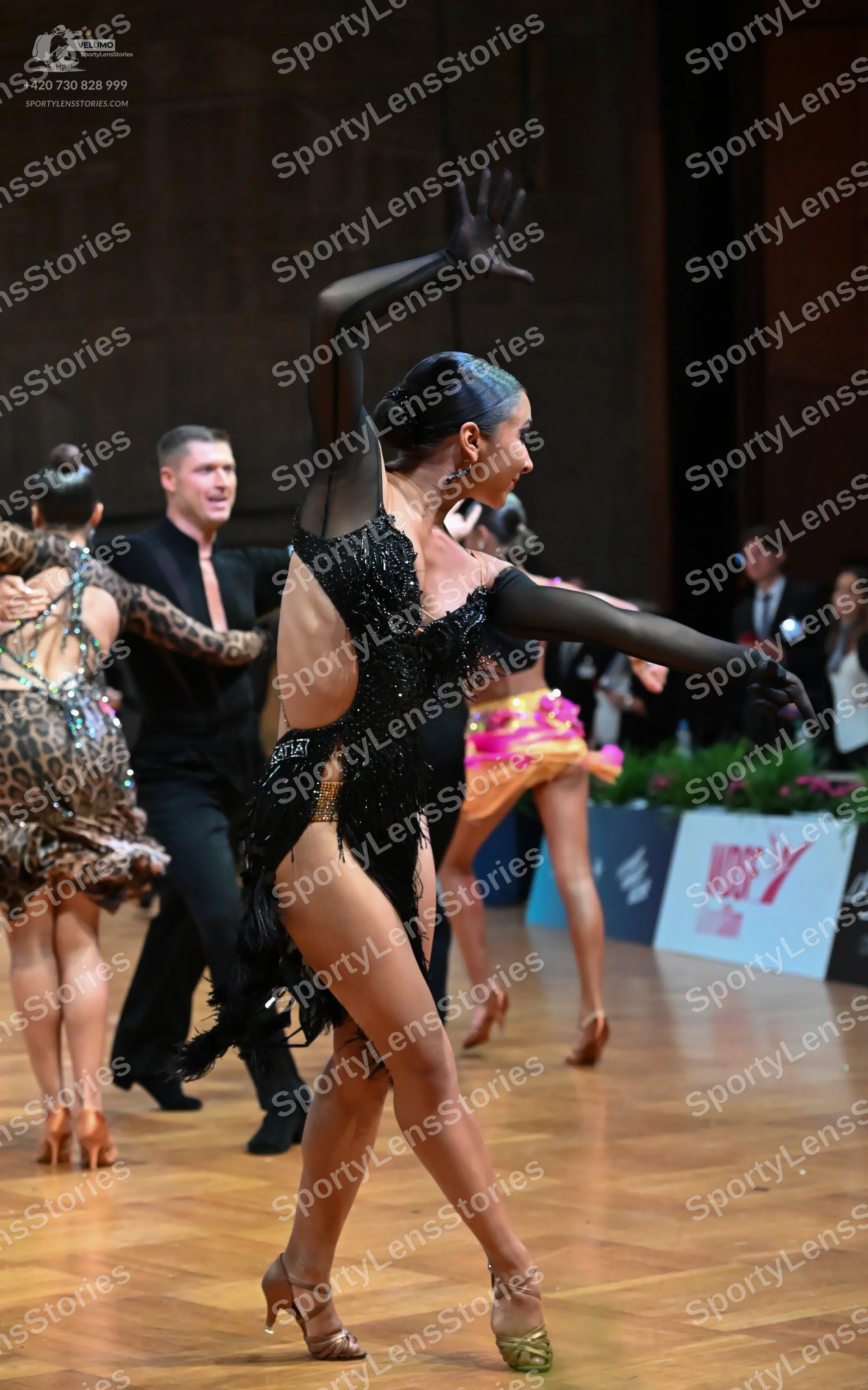 Dancesport competitor: Male dancer: black long-sleeved shirt and black trousers