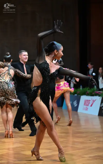 Dancesport competitor: Male dancer: black long-sleeved shirt and black trousers
