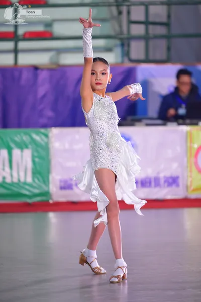 Dancesport competitor: ** White latin dress