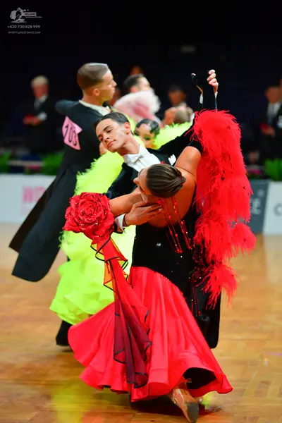 Dancesport competitor: Male dancer (foreground): black suit with a white shirt
