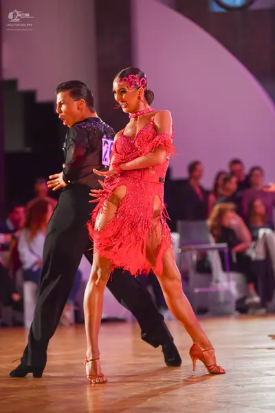 Dancesport competitor #26: Male dancer: black long-sleeved latin dance shirt and black trousers