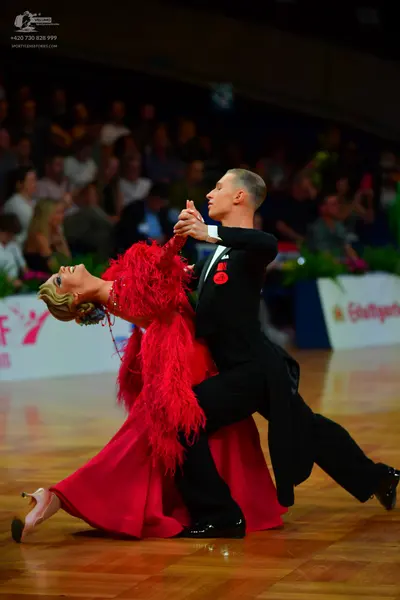 Dancesport competitor: Male dancer: black ballroom suit with a white shirt and black bowtie