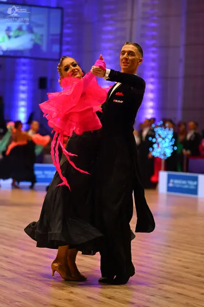 Dancesport competitor: Male dancer: black formal suit