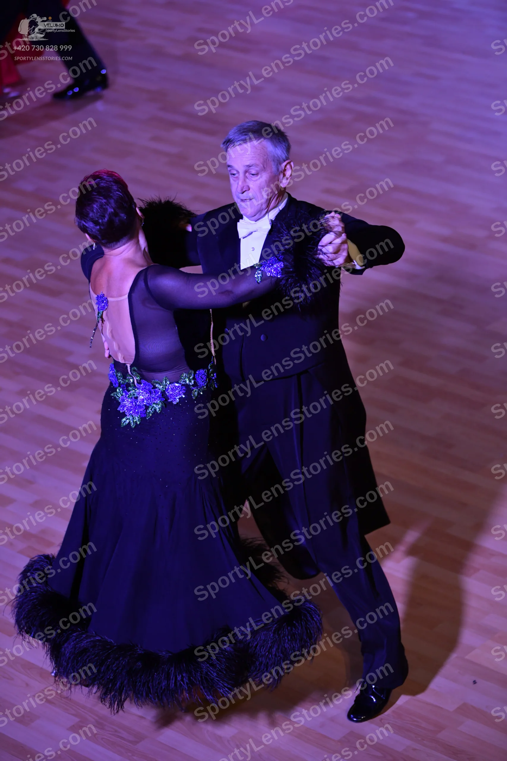 Dancesport competitor: Male:** Black suit with a sequin lapel and black dress shoes