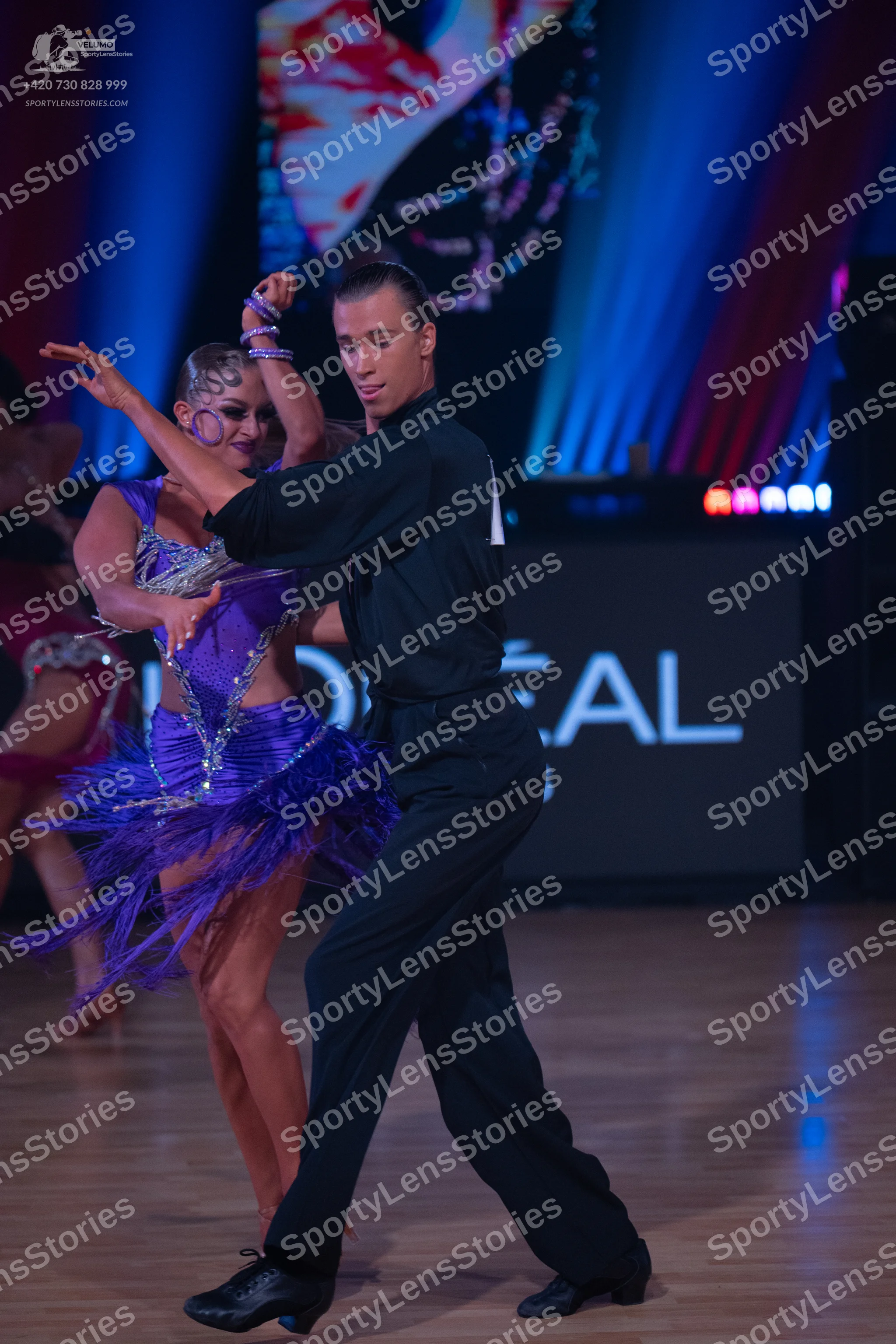 Dancesport competitor: Male dancer: black long-sleeved shirt and black trousers