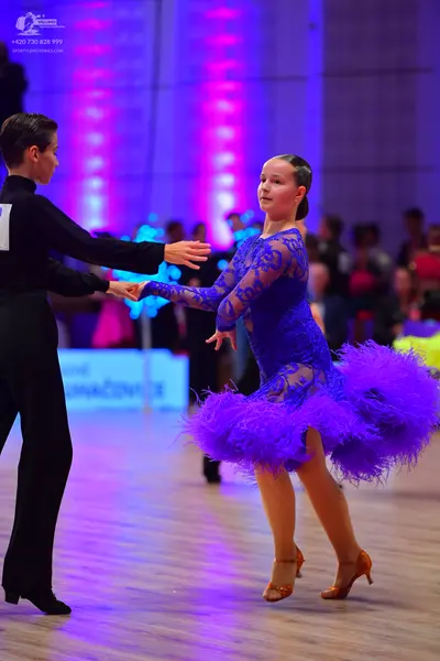 Dancesport competitor: Male dancer: black long-sleeved shirt and black trousers