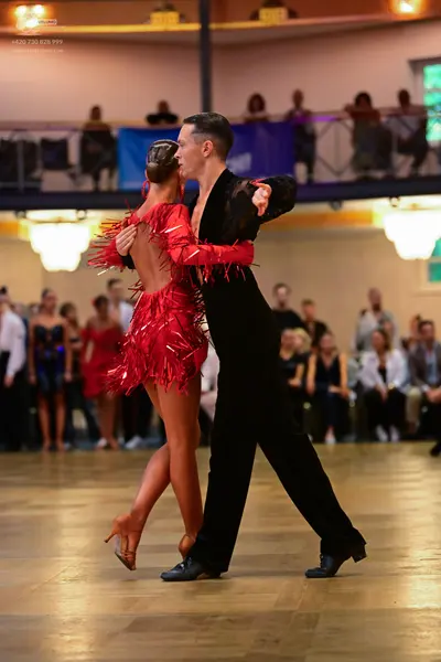 Dancesport competitor: Male dancer: black suit