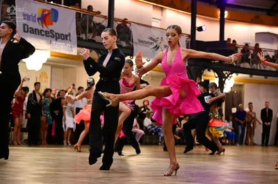 Dancesport competitor: Male dancer (foreground): black suit