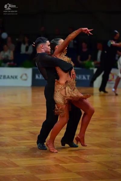Dancesport competitor: Male dancer: black long-sleeved shirt and black trousers