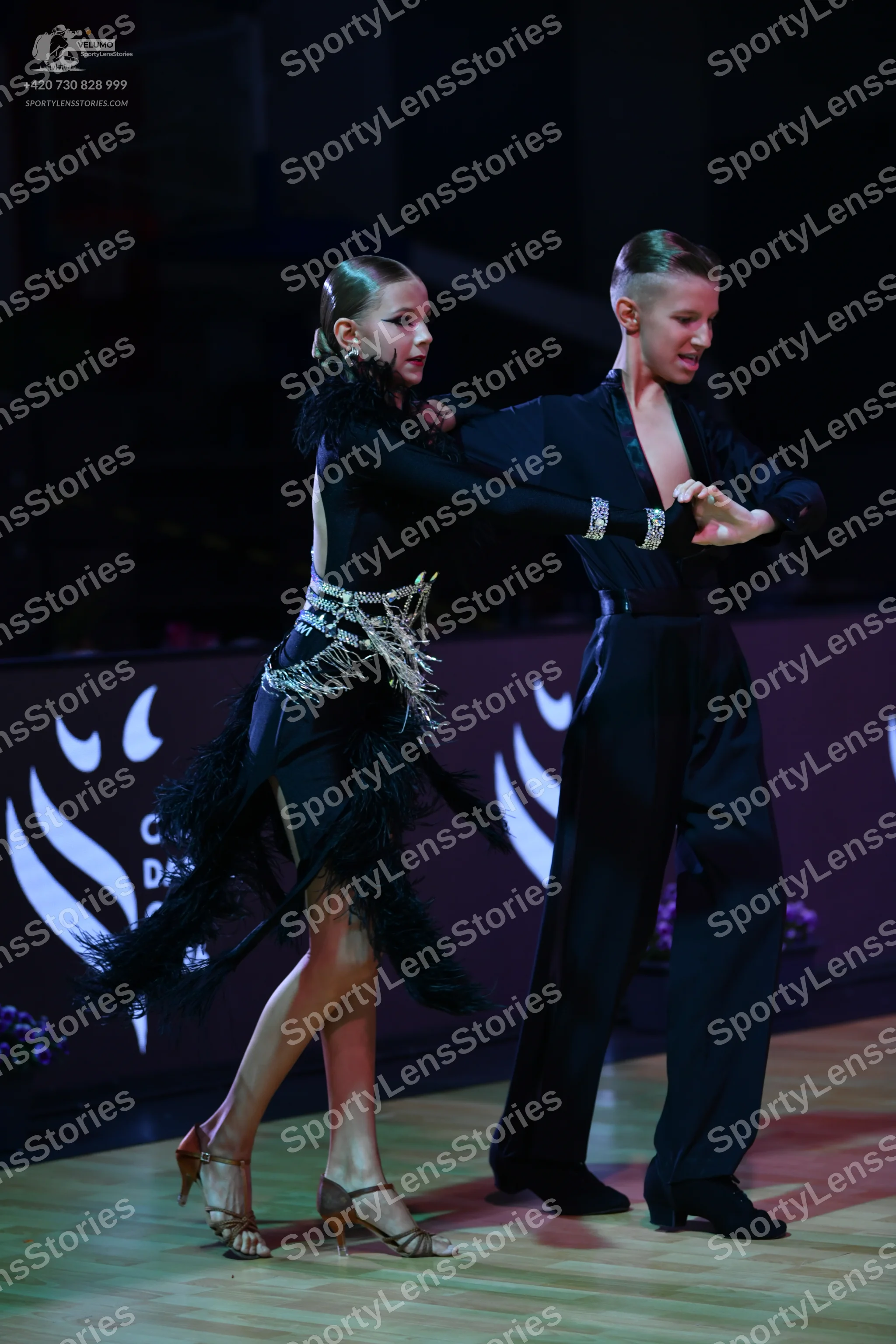 Dancesport competitor: Male dancer: black long-sleeved dance shirt and black trousers