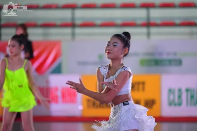 Dancesport competitor: ** Female
*   **Color:** Neon Green
*   **Fabric:** Shiny, likely satin or a sim