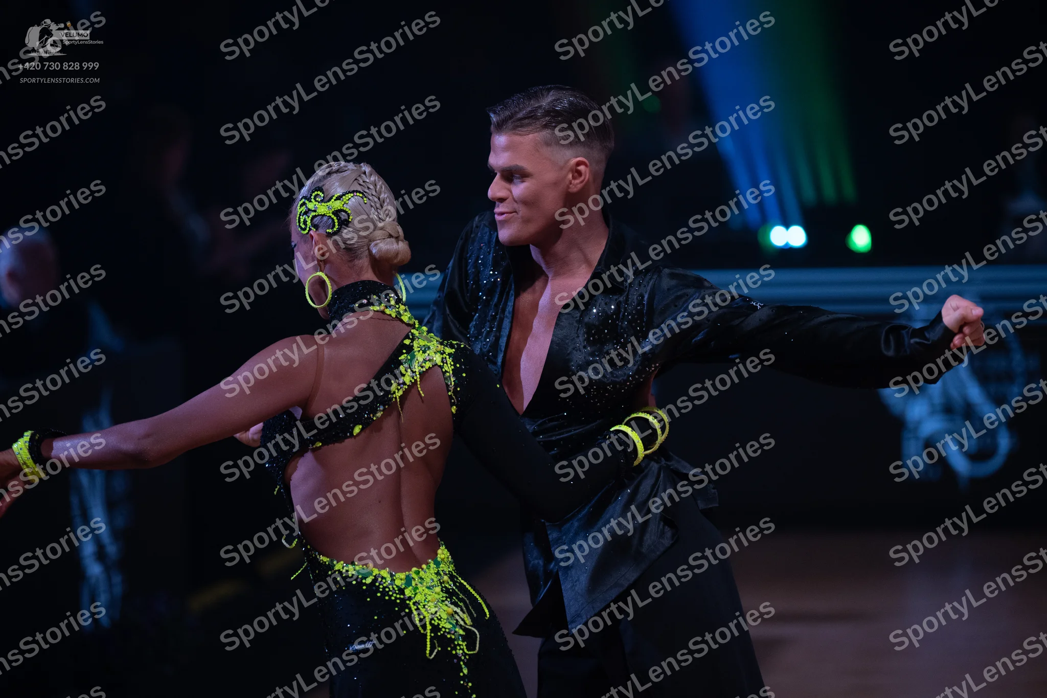 Dancesport competitor: Male dancer: black long-sleeved shirt with subtle sequins and black trousers