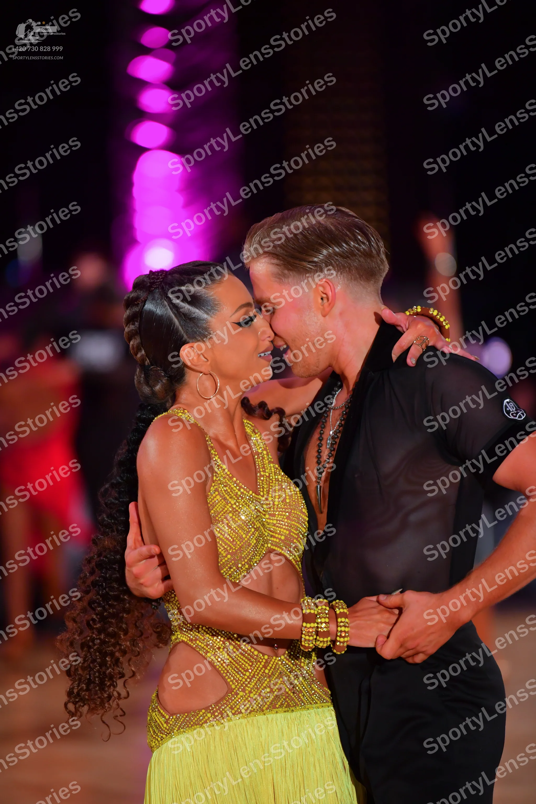 Dancesport competitor: Female dancer: yellow latin dance costume with a sequined/beaded bodice featurin