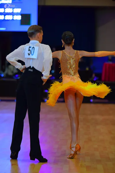 Dancesport competitor #50: Male dancer: white long-sleeved shirt and black trousers