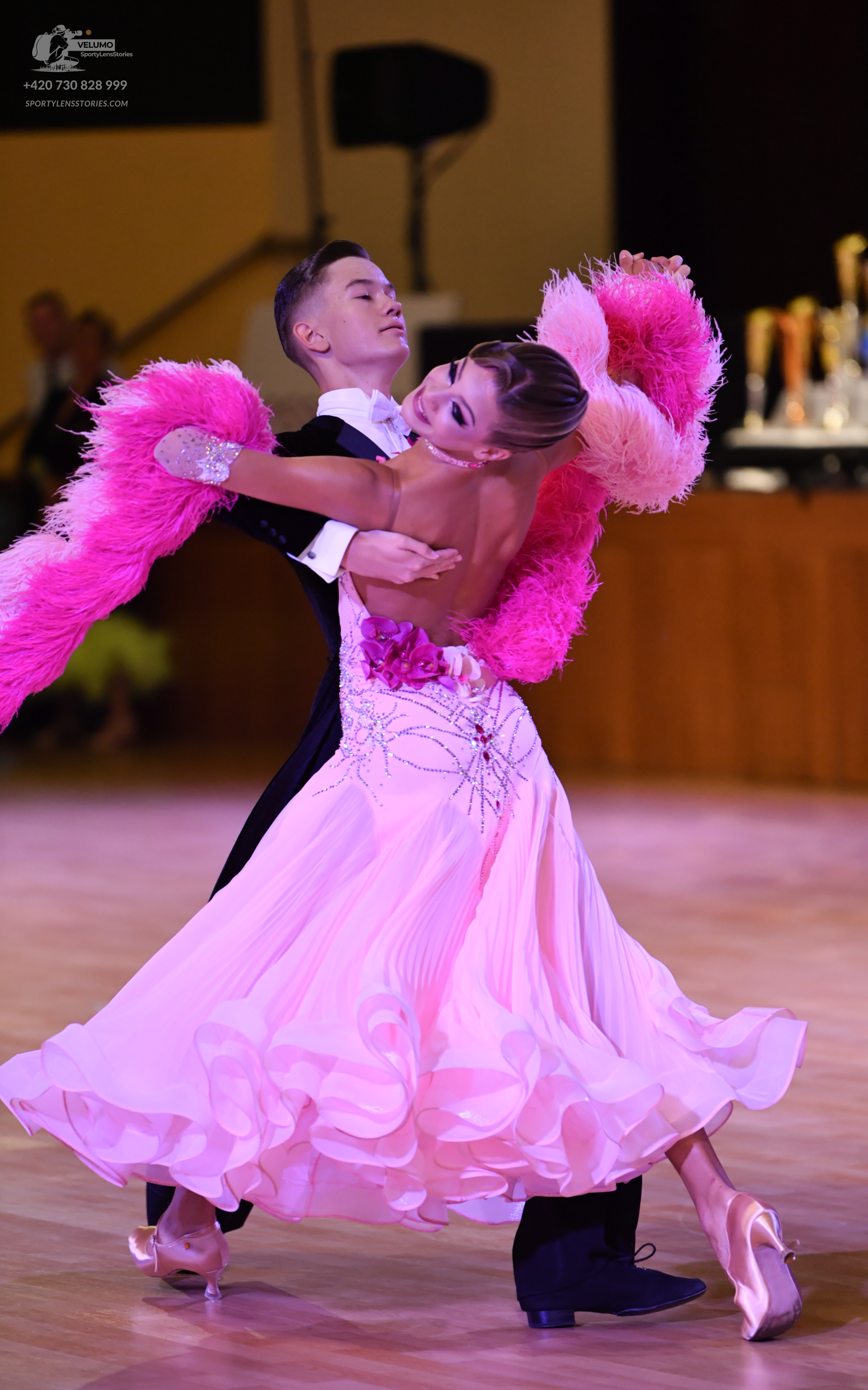 Dancesport competitor: **

*   **Male Dancer:** Black tail suit with silver sequins covering the lapels