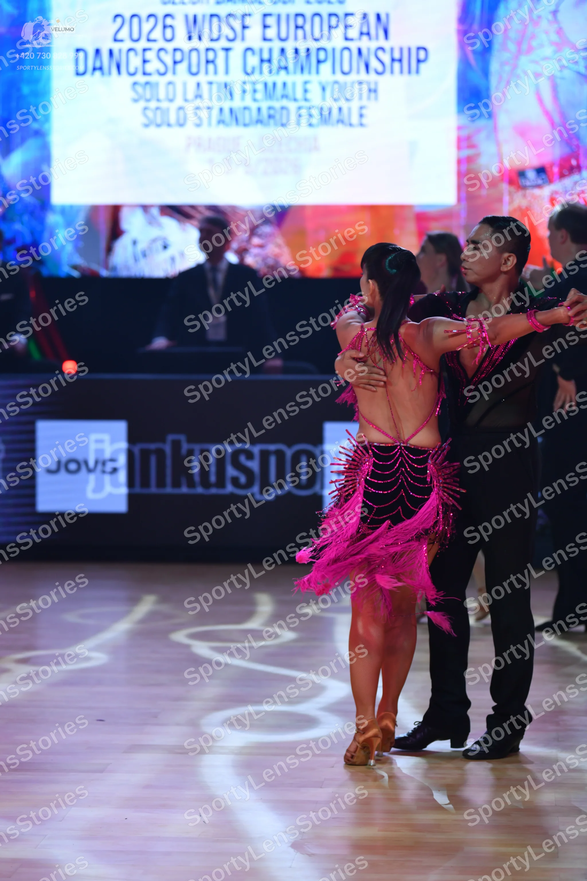 Dancesport competitor: Male dancer: black mesh-style shirt with subtle embellishments and black trouser