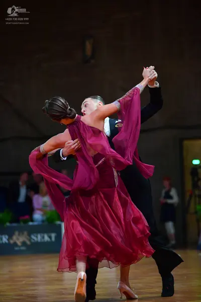 Dancesport competitor: Male dancer: black suit