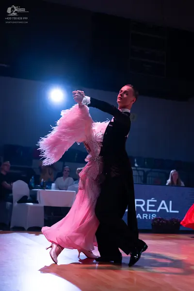 Dancesport competitor: Male dancer: black suit with white shirt and black bowtie