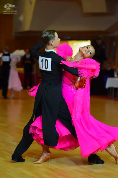 Dancesport competitor #10: Male dancer: black long-sleeved top with white collar and black trousers