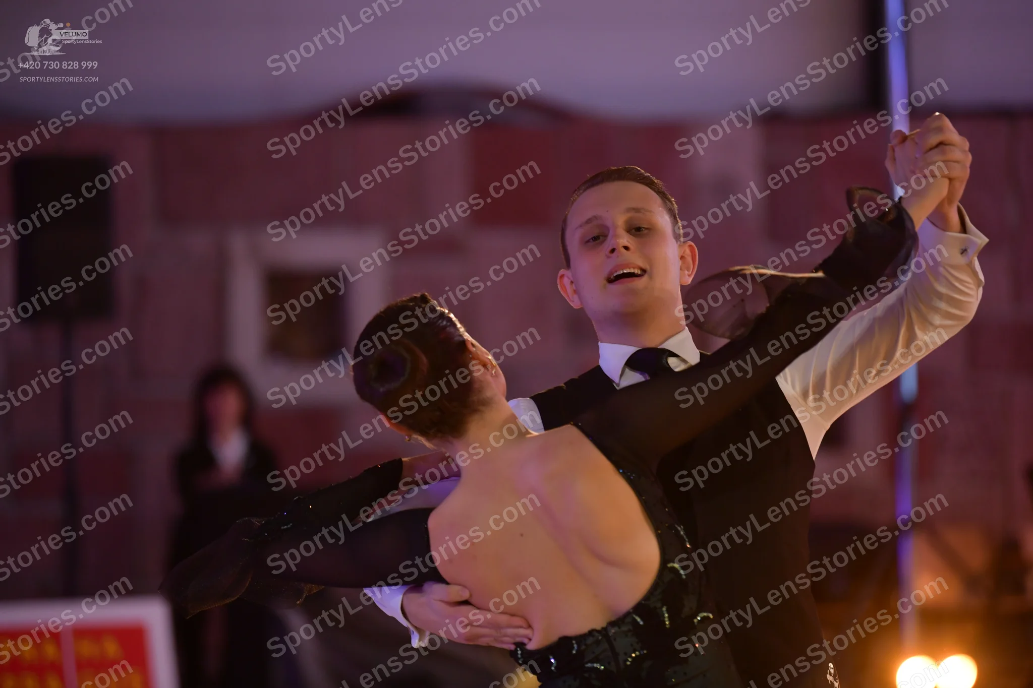 Dancesport competitor: Male dancer: black waistcoat, white long-sleeved shirt, and black necktie