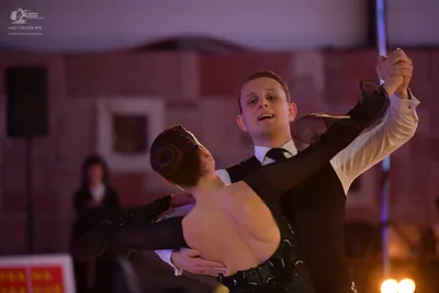 Dancesport competitor: Male dancer: black waistcoat, white long-sleeved shirt, and black necktie