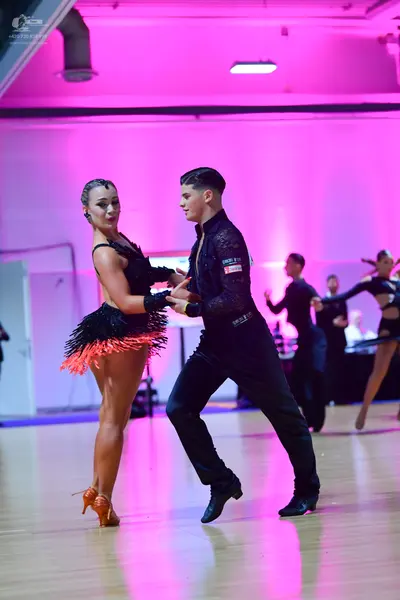 Dancesport competitor: Male dancer: black long-sleeved shirt with subtle texture and black trousers