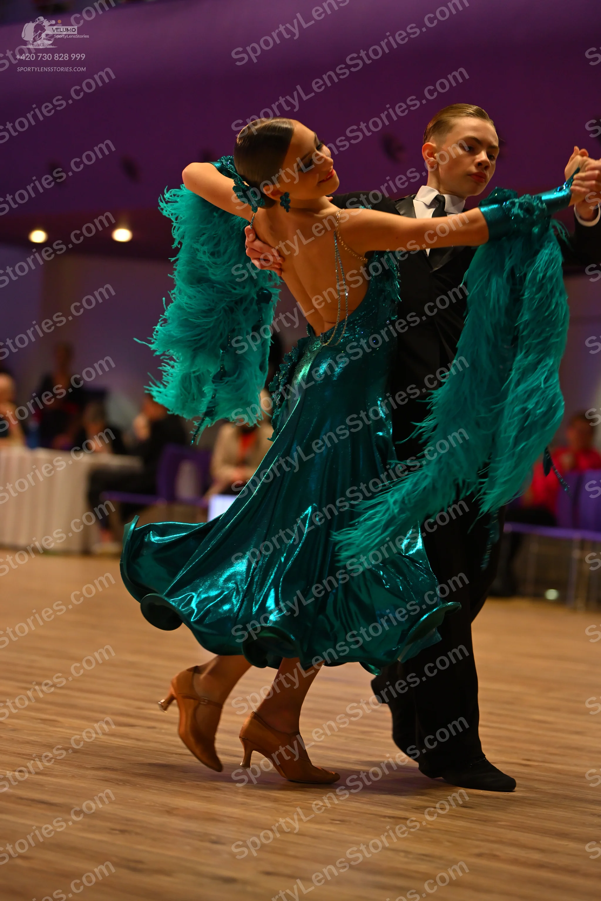 Dancesport competitor: Male dancer: black suit with a white shirt and black tie