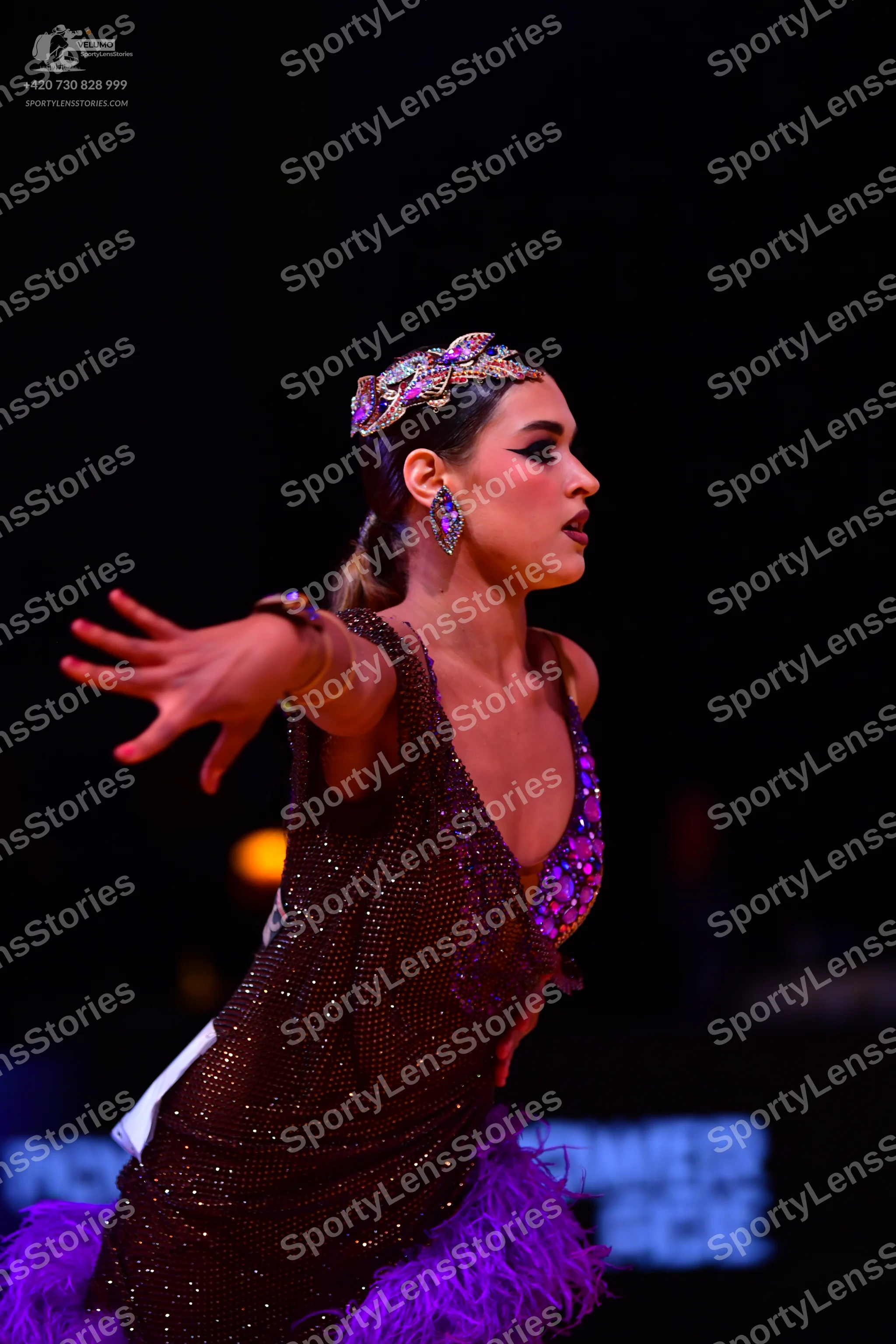 Dancesport competitor: Female dancer: dark brown/bronze latin dress covered in sequins and crystals, fe