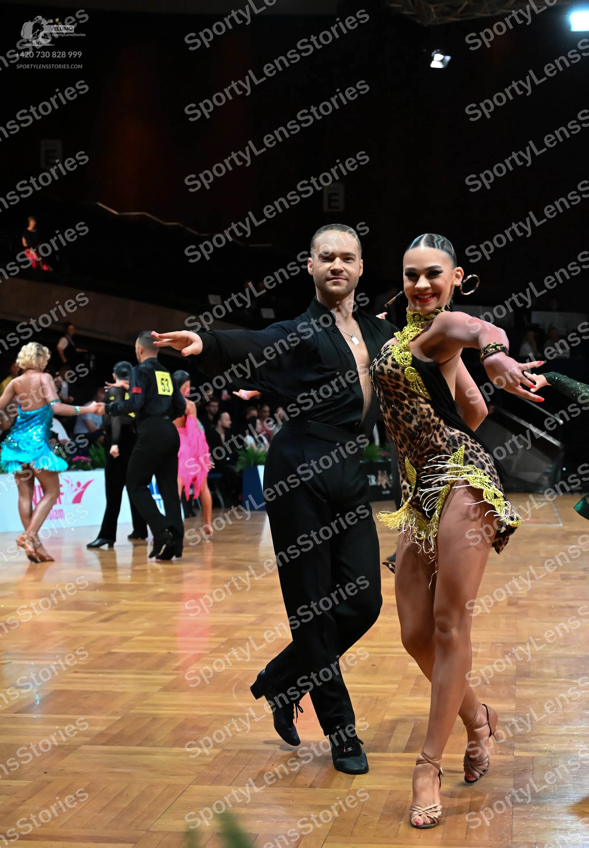 Dancesport competitor #53: Foreground male dancer: black long-sleeved shirt and black trousers