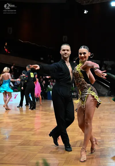 Dancesport competitor #53: Foreground male dancer: black long-sleeved shirt and black trousers