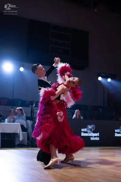 Dancesport competitor: Male dancer: black suit, white shirt, and black bow tie
