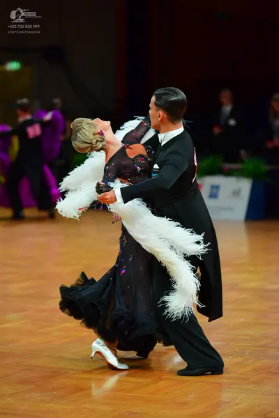 Dancesport competitor: Male dancer: black ballroom tailcoat