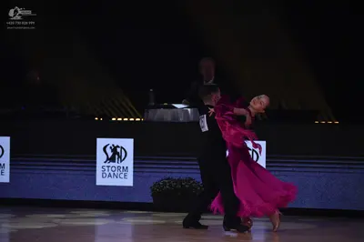 Dancesport competitor: Male dancer: black suit