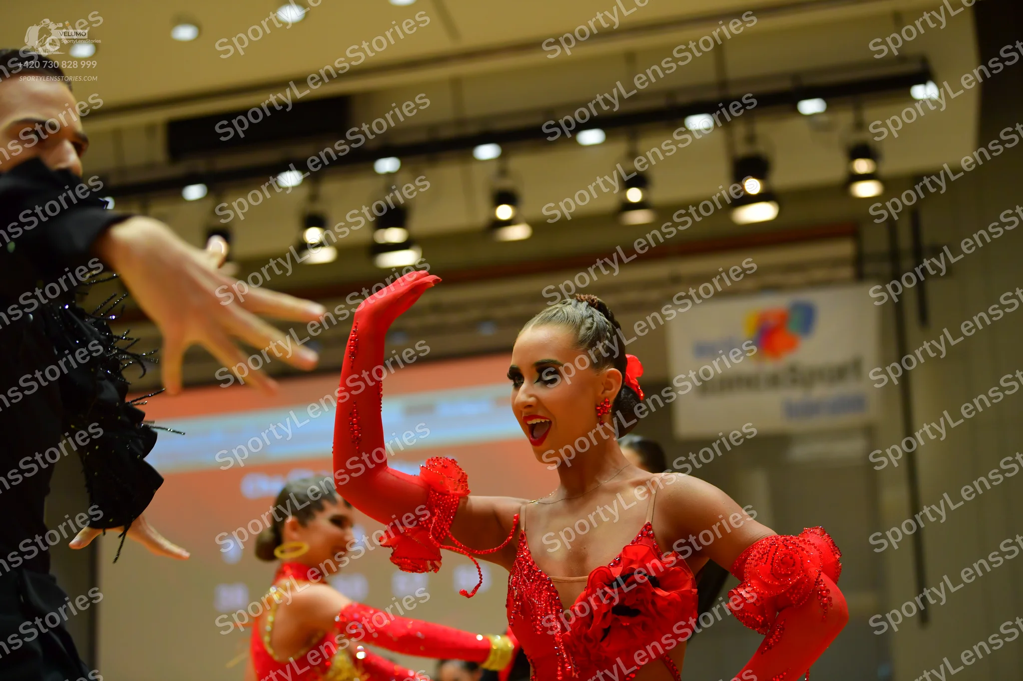 Dancesport competitor: Male dancer: black long-sleeved top with subtle black embellishments