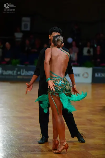 Dancesport competitor: Male dancer: black long-sleeved top