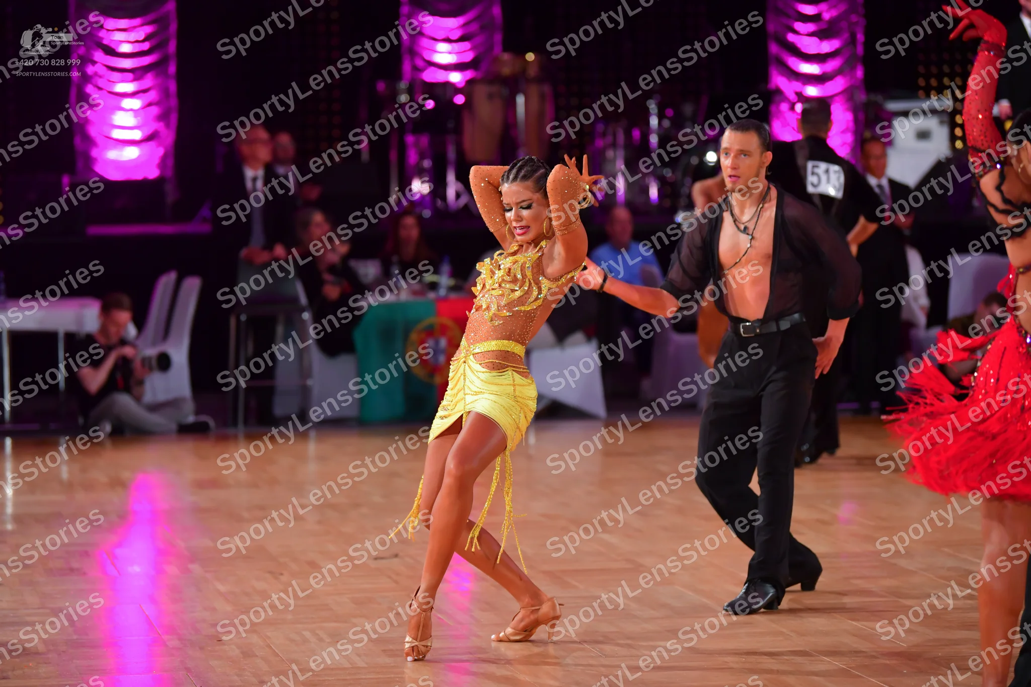 Dancesport competitor: Female dancer: yellow Latin dress with long yellow fringe