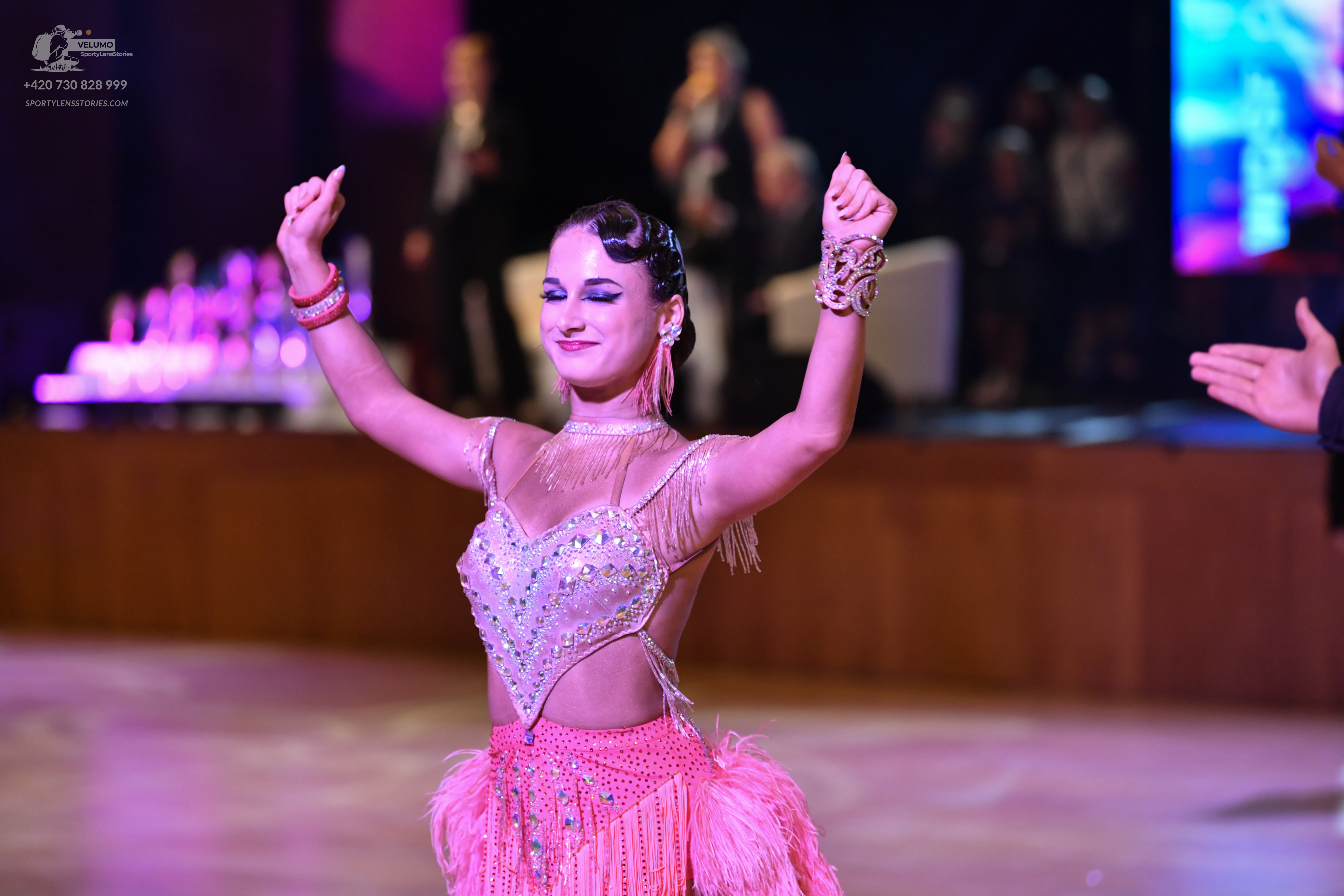 Dancesport competitor: ** Pink Latin Dress
*   **Color:** Primarily pale pink with accents of white